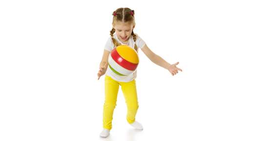 Little girl bouncing a ball