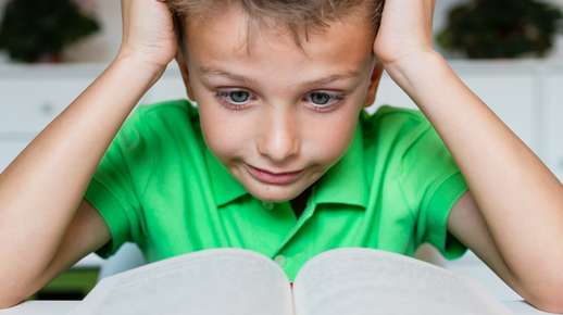 Boy Reading Confused