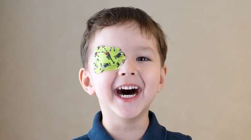 Boy wearing a colorful eye patch