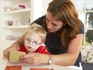 Woman working with a toddler