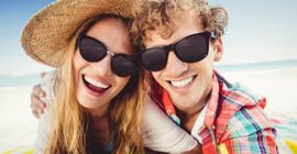 Happy couple wearing sunglasses