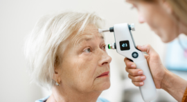 eye doctor using tonometer
