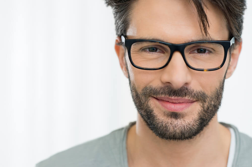 Closeup of smiling man wearing eyeglass