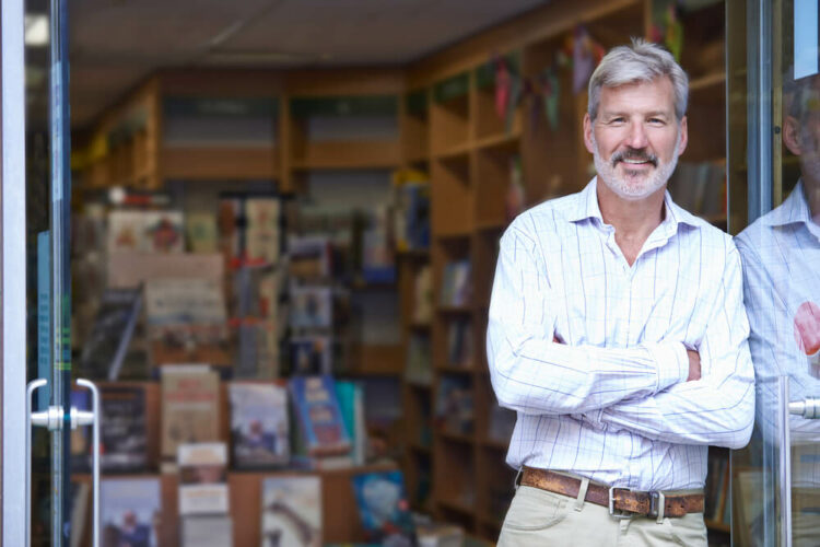 Man standing outside a book store