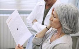 Woman checking vision with Amsler grid