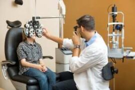 Eye doctor examining a child patient