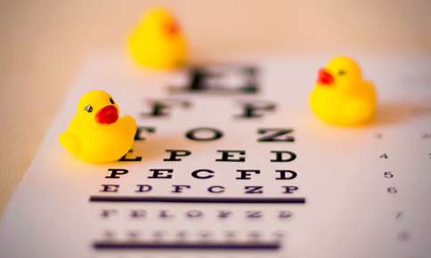Toy ducks and eye chart